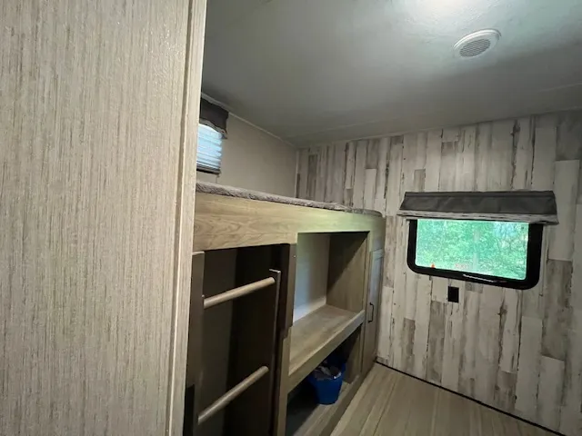 a view of washer and dryer with wooden floor