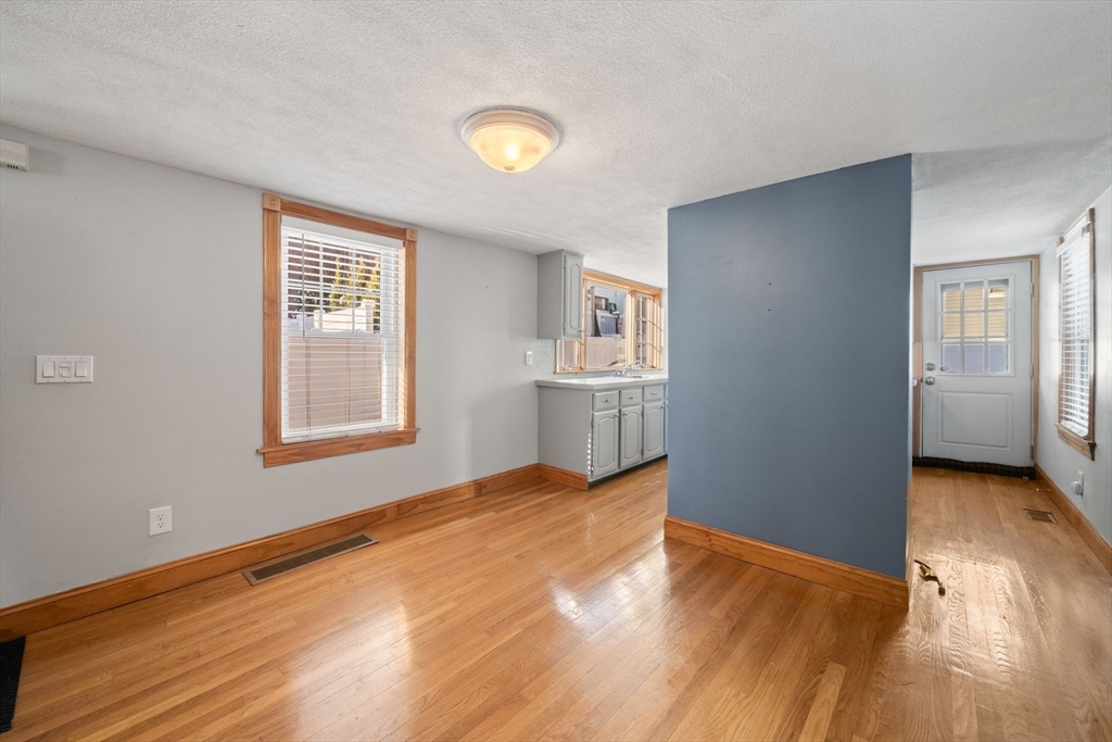86-88 Pearl Street Boston, MA 02129 - Photo 15 of 30 a view of empty room with wooden floor and fan