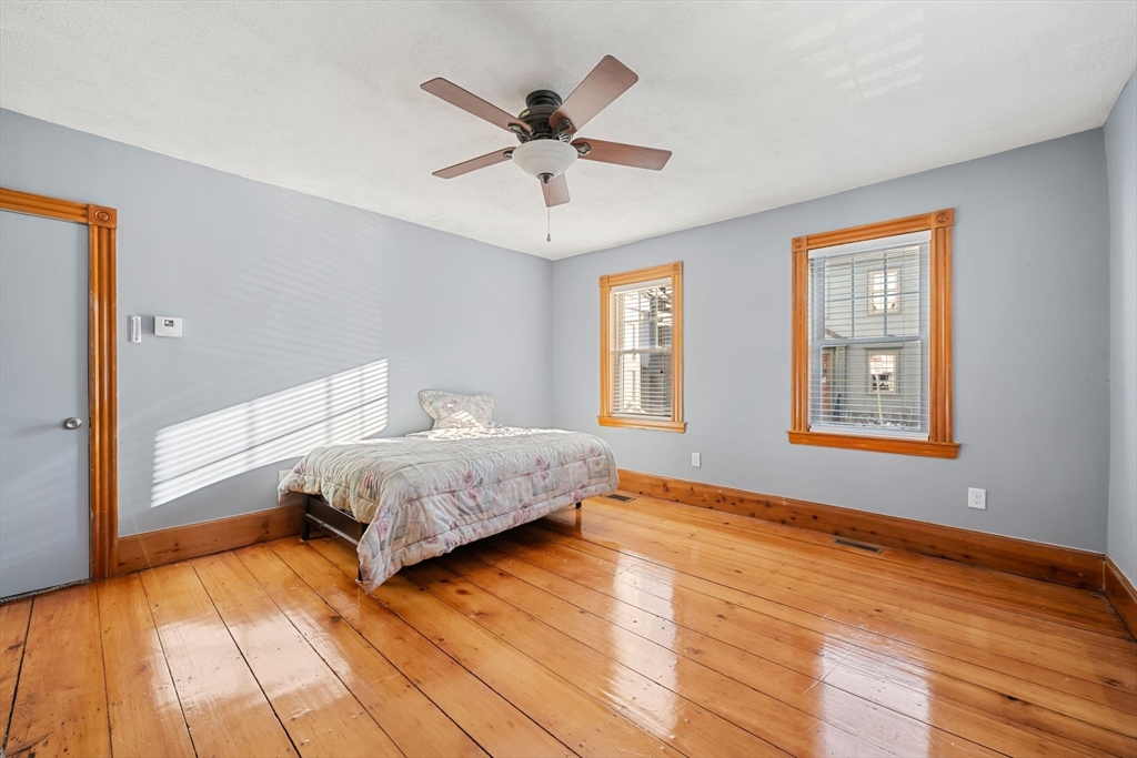 86-88 Pearl Street Boston, MA 02129 - Photo 9 of 30 a bedroom with a bed and window