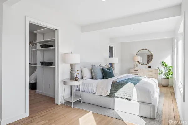a bedroom with bed and a dresser