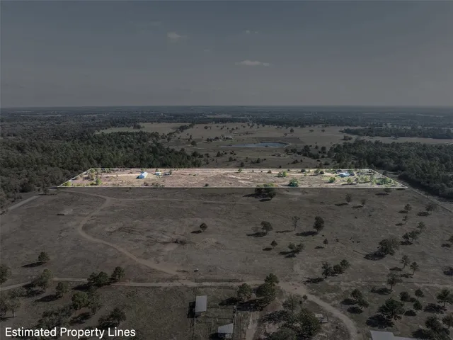 a view of a dry yard with wooden floor