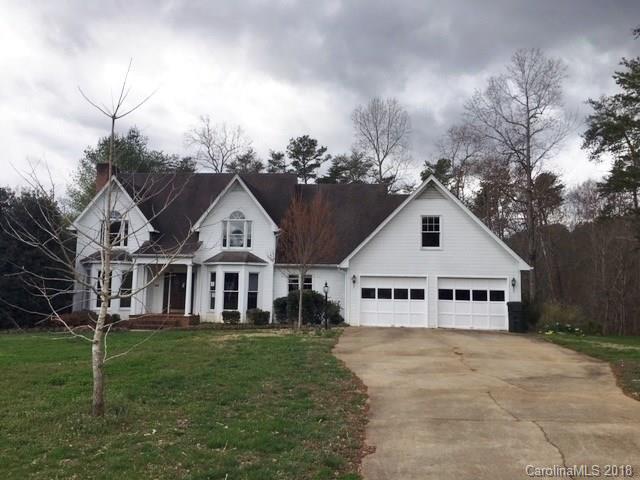 154 Brightmore Circle Rutherfordton, NC 28139 - Photo 1 of 7 a view of a white house with a big yard and large trees