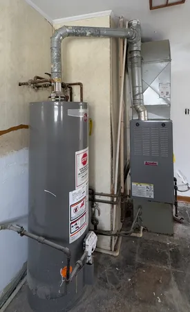 a room with water heater and a wooden door