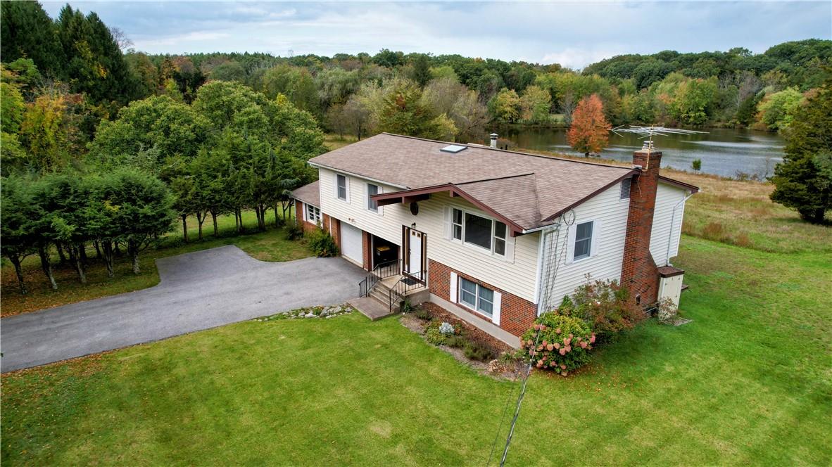 an aerial view of a house with a garden