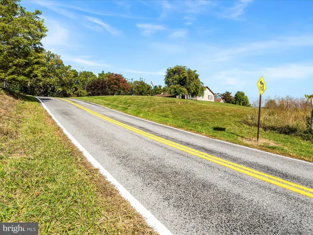 a view of a yard and ocean view