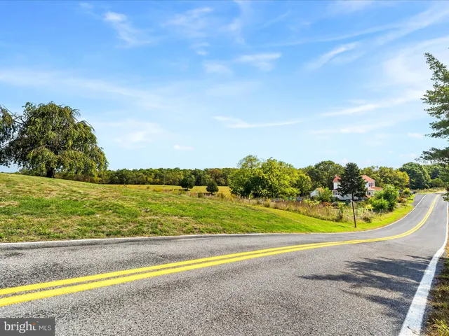 a view of a swimming pool with an ocean view