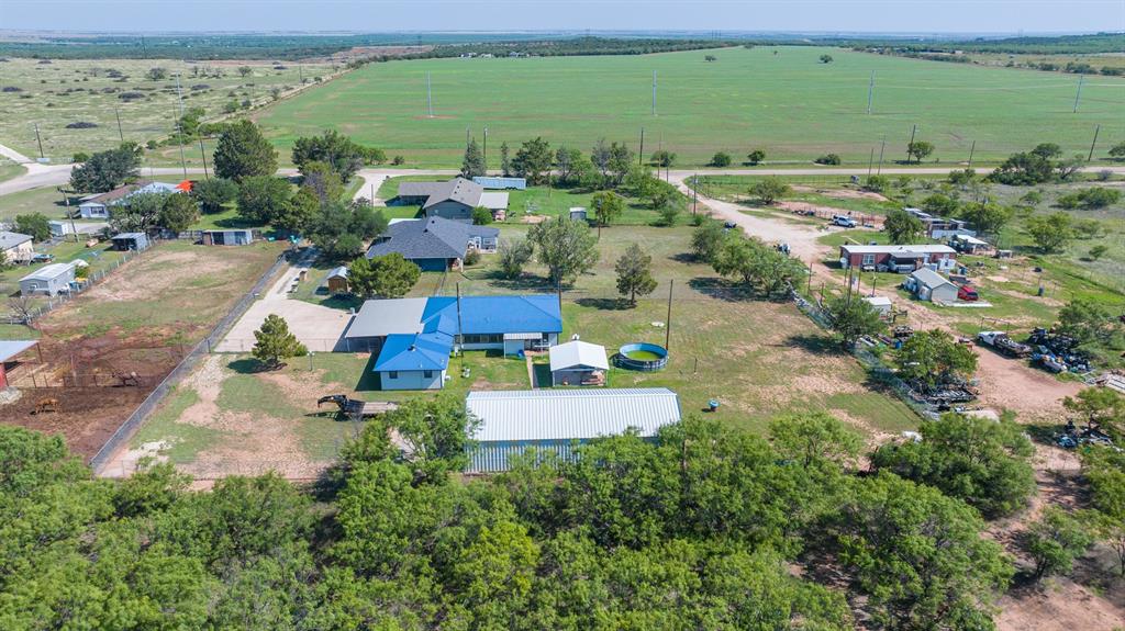 8867 Spinks Road Abilene, TX 79603 - Photo 8 of 9 View looking North. shop has white roof. house has blue roof.