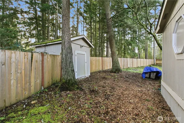 a house view with a backyard space