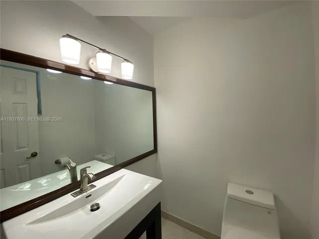 a bathroom with a sink and a toilet
