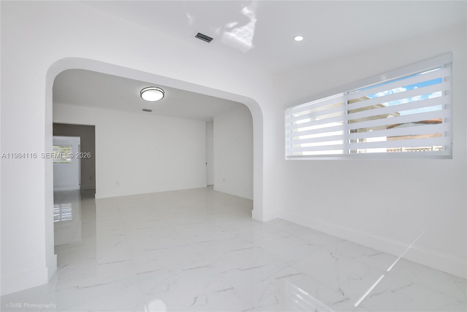 6337 Southwest 11th Street West Miami, FL 33144 - Photo 11 of 28 a view of an empty room with a window