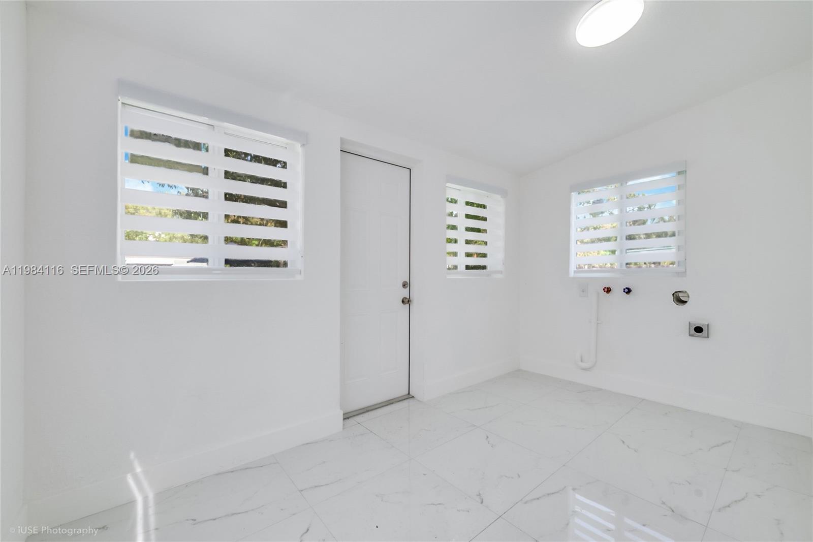 6337 Southwest 11th Street West Miami, FL 33144 - Photo 16 of 28 an empty room with windows