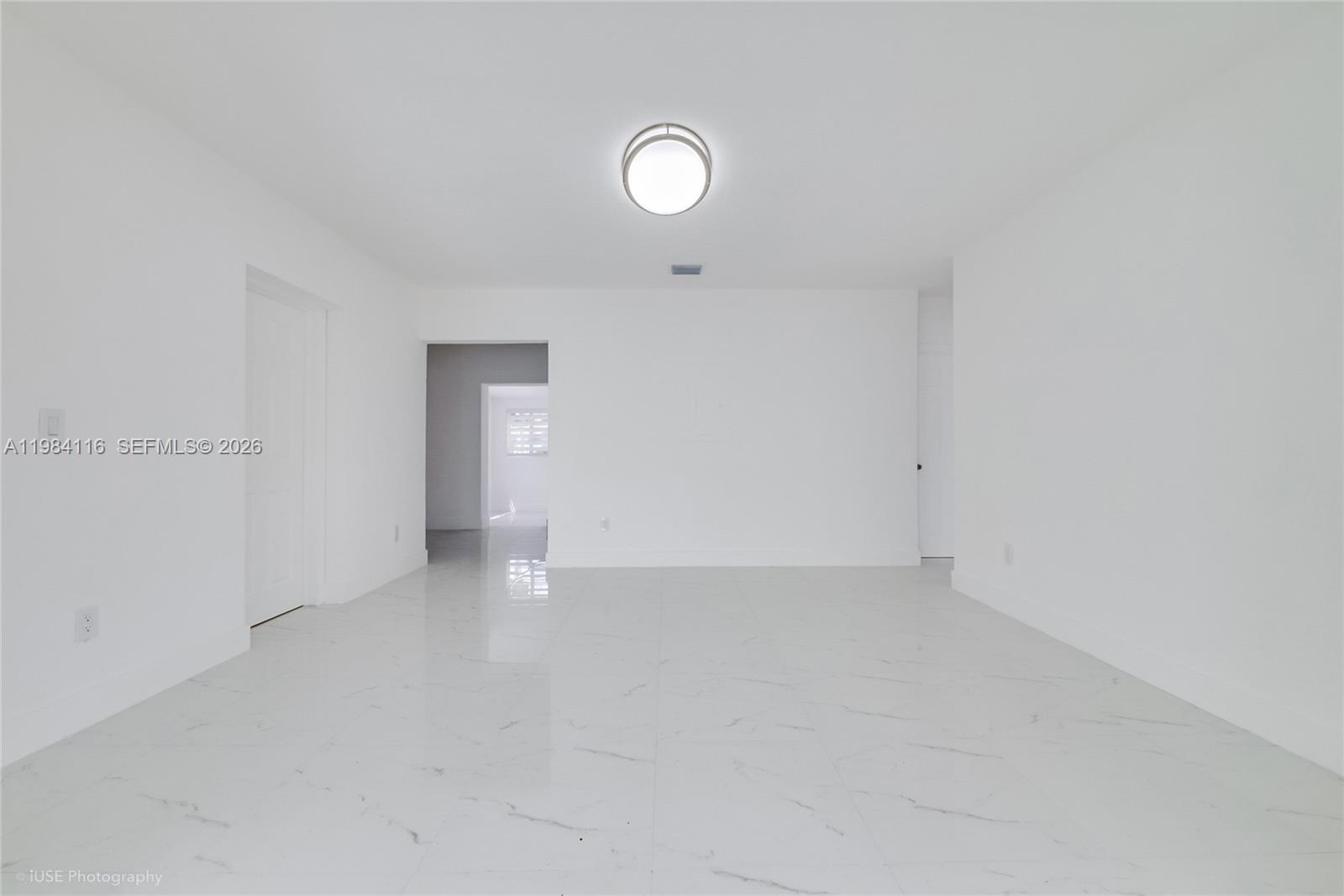 6337 Southwest 11th Street West Miami, FL 33144 - Photo 17 of 28 a view of an empty room with a window