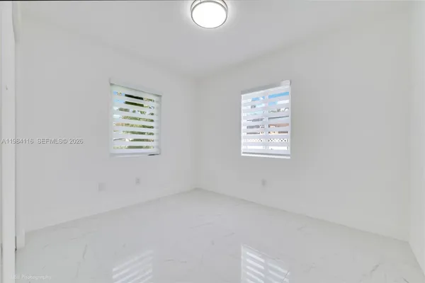 an empty room with windows