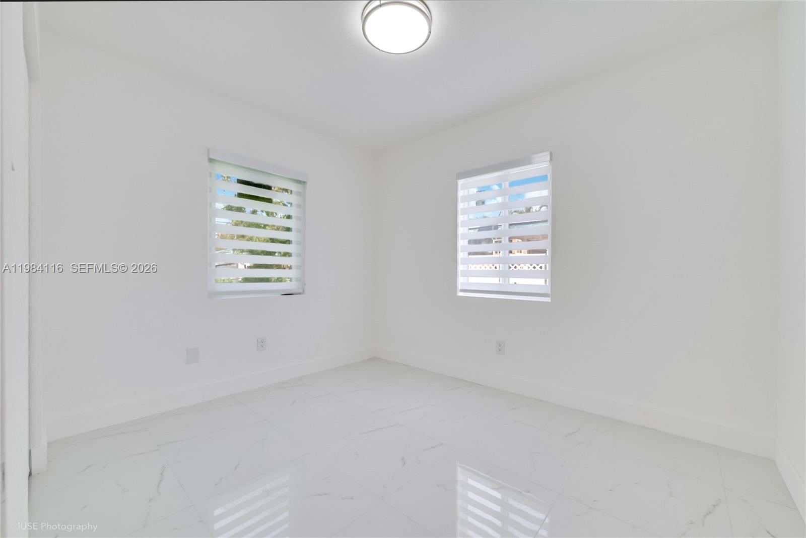 6337 Southwest 11th Street West Miami, FL 33144 - Photo 18 of 28 an empty room with windows