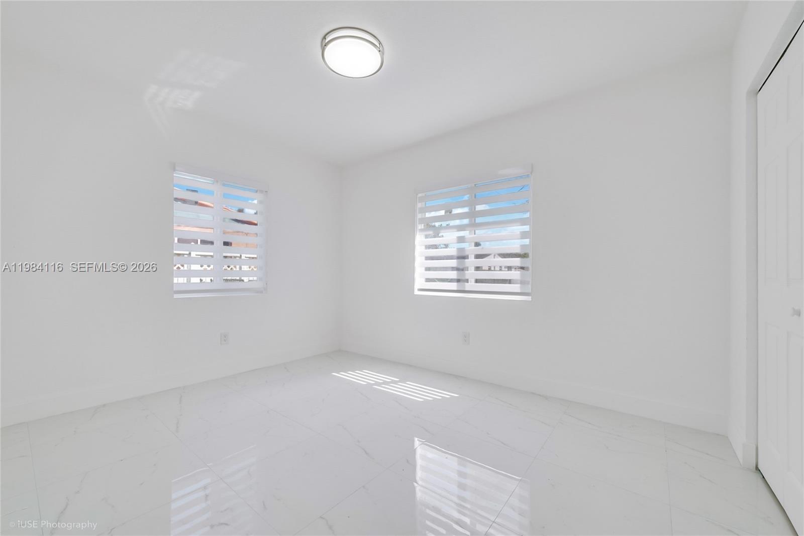 6337 Southwest 11th Street West Miami, FL 33144 - Photo 19 of 28 an empty room with windows