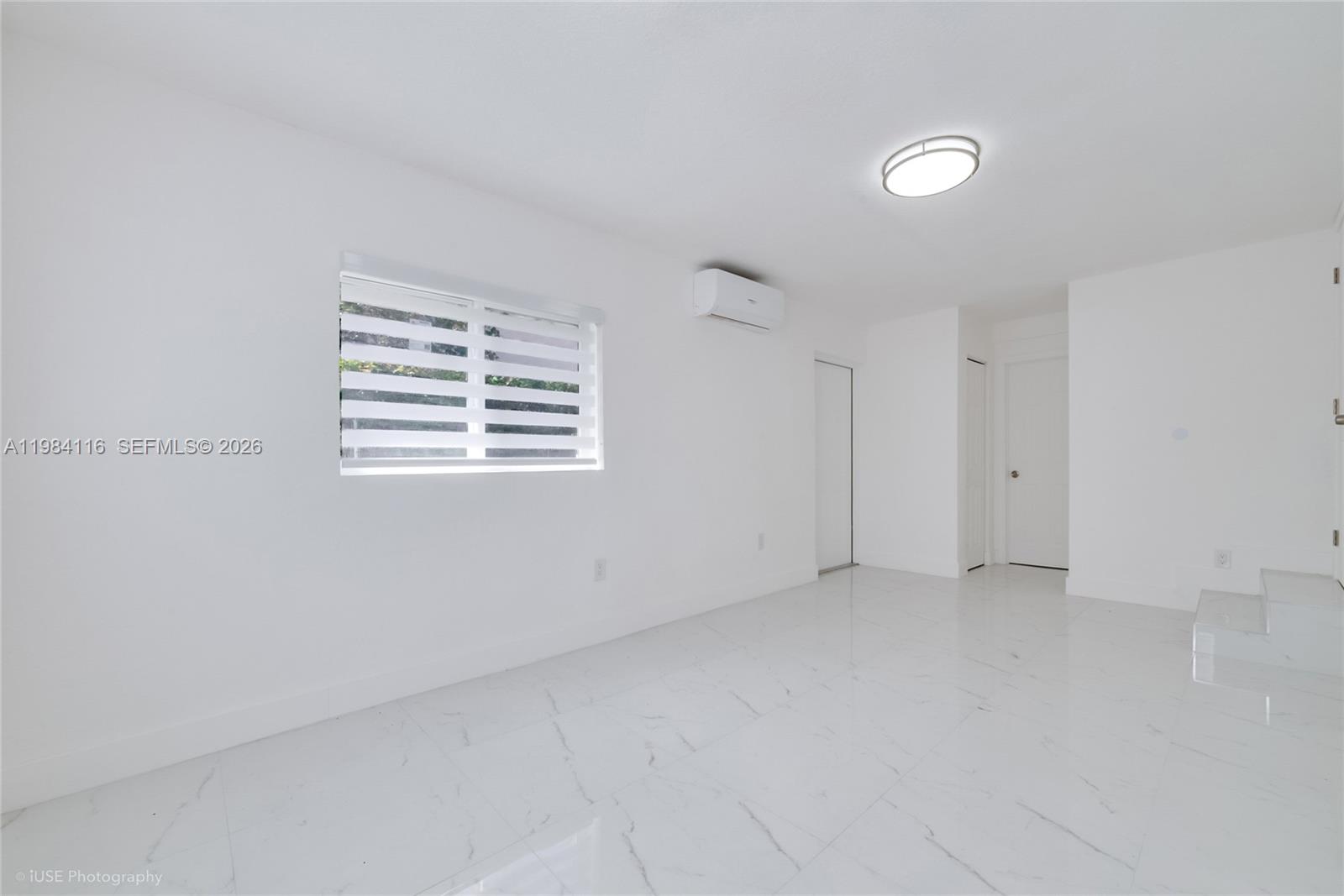 6337 Southwest 11th Street West Miami, FL 33144 - Photo 21 of 28 a view of an empty room with a window