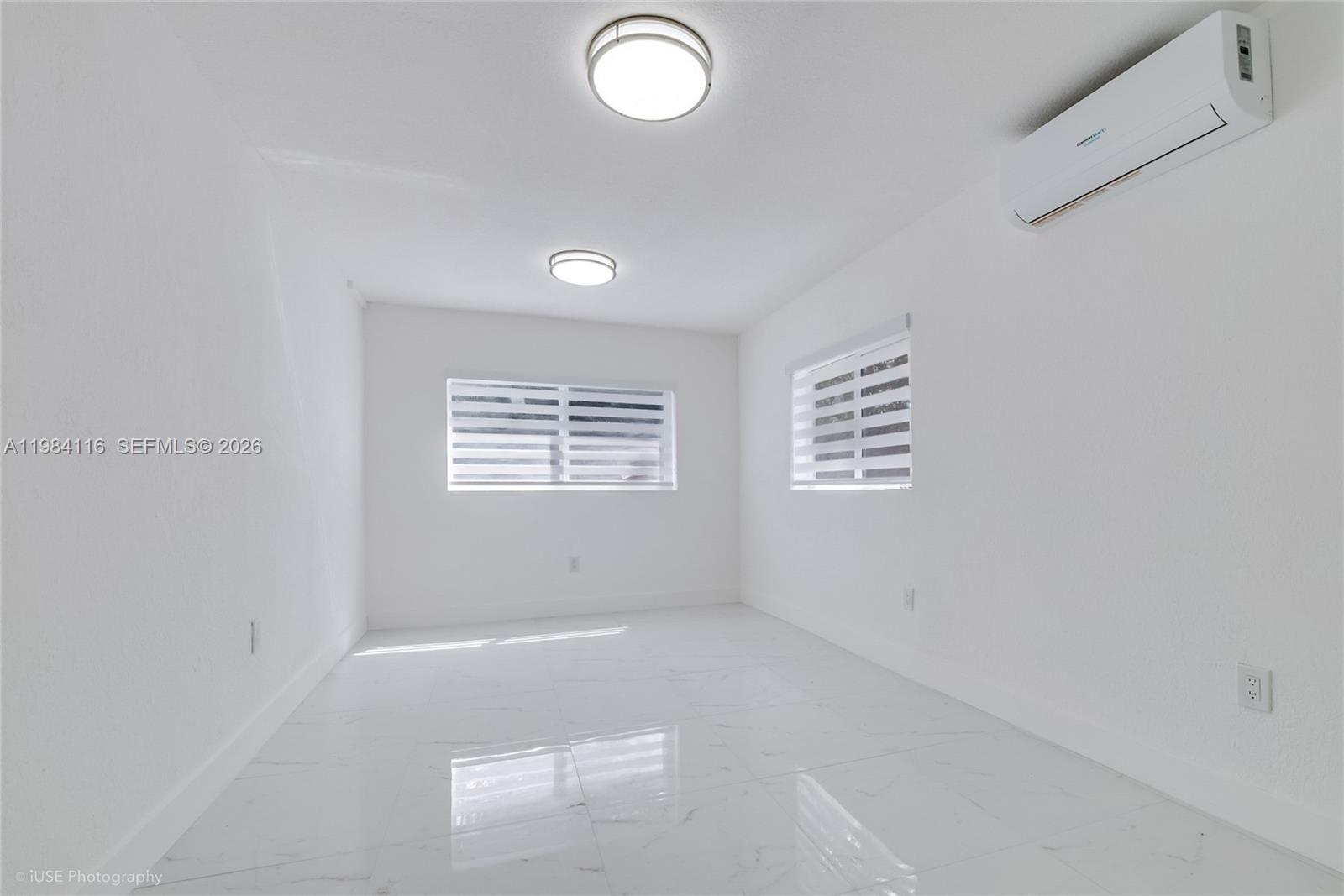 6337 Southwest 11th Street West Miami, FL 33144 - Photo 23 of 28 a view of an empty room with a window