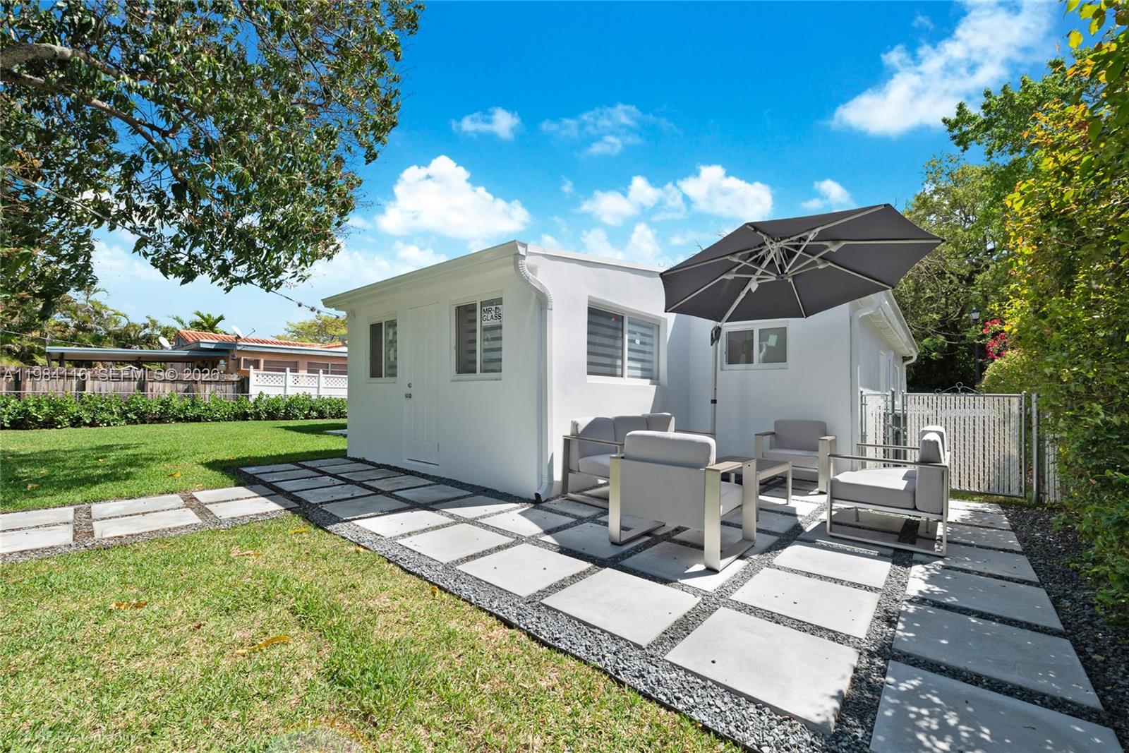 6337 Southwest 11th Street West Miami, FL 33144 - Photo 24 of 28 a view of backyard of house with seating space