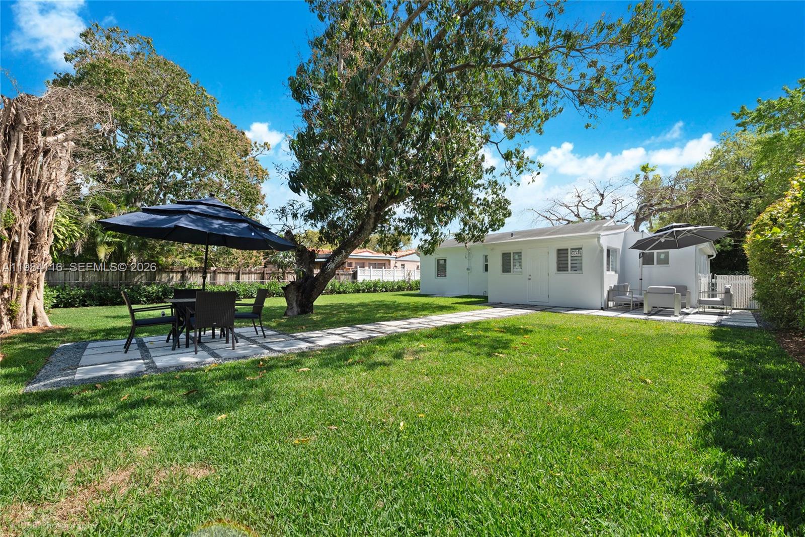 6337 Southwest 11th Street West Miami, FL 33144 - Photo 25 of 28 a view of a house with a backyard