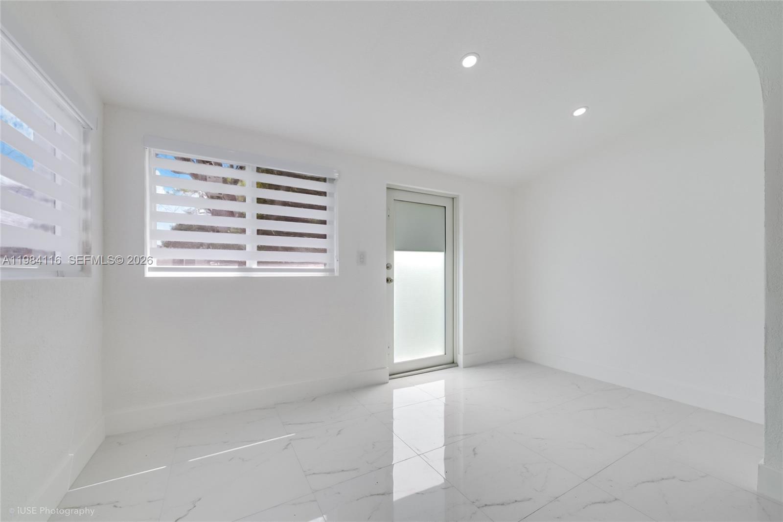 6337 Southwest 11th Street West Miami, FL 33144 - Photo 8 of 28 a view of an empty room with a window