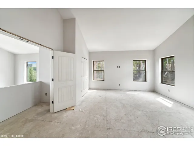 a big room with windows and closet