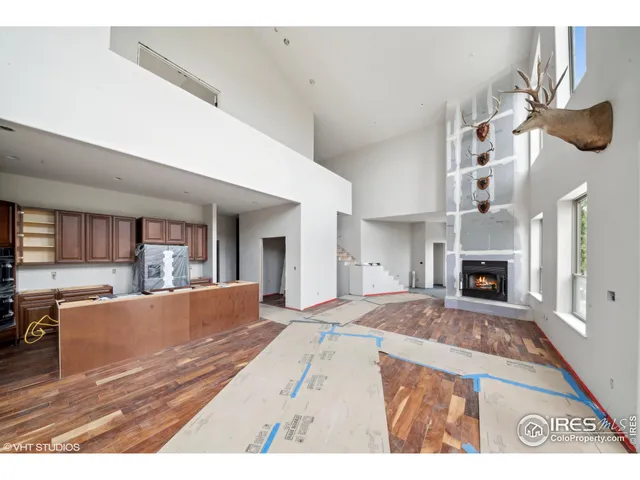 a view of living room with furniture and fireplace