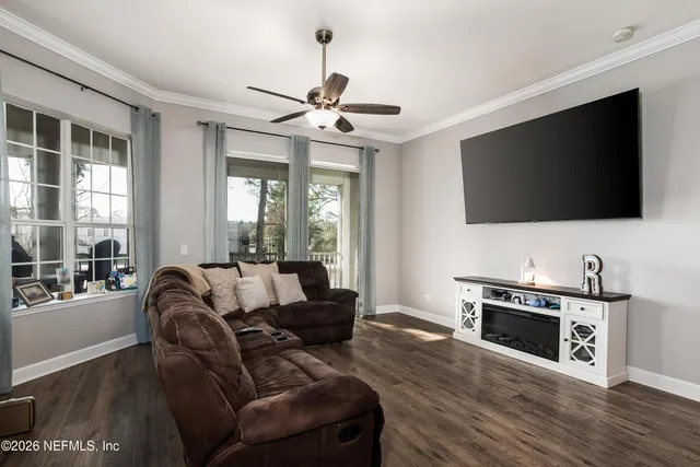 a living room with furniture and a flat screen tv