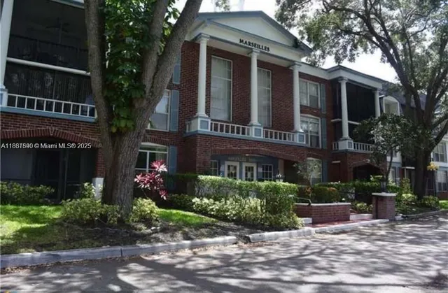 a view of a building with a garden