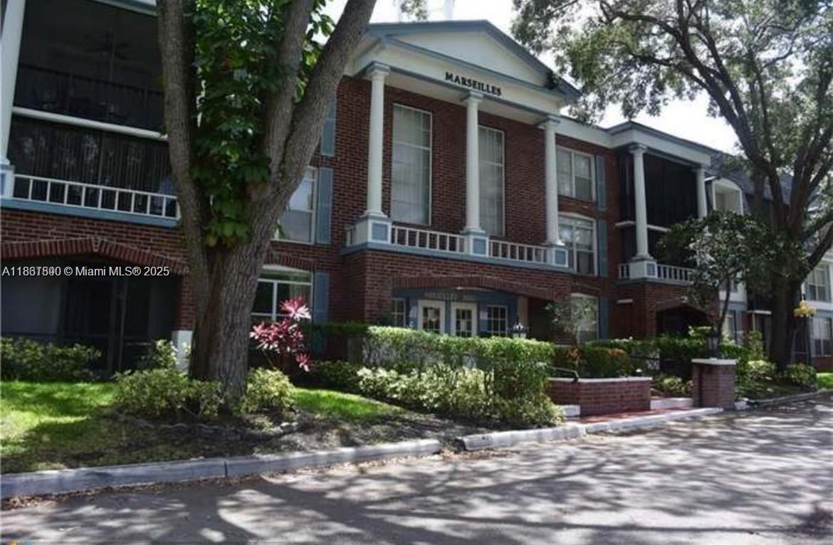 a view of a building with a garden