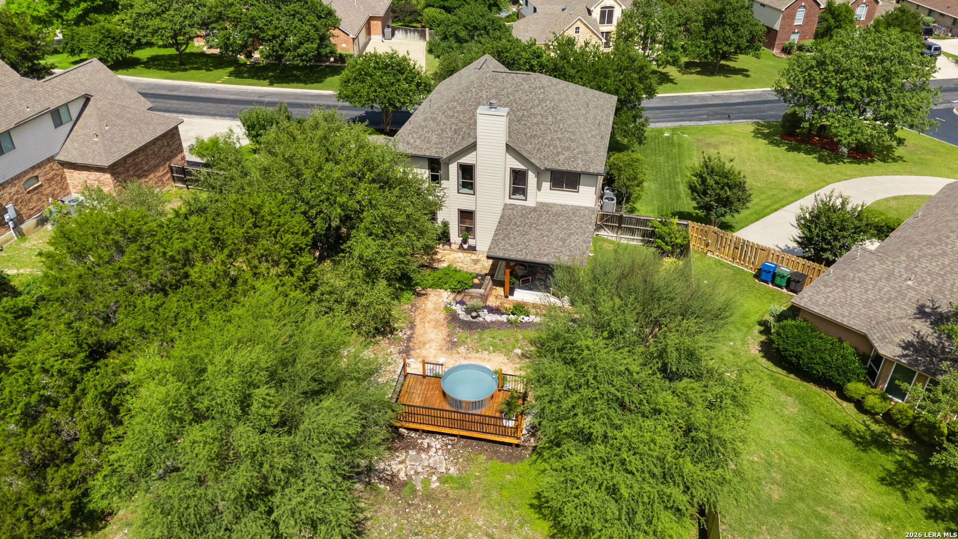 14507 John David Helotes, TX 78023 - Photo 1 of 52 an aerial view of a house with a garden