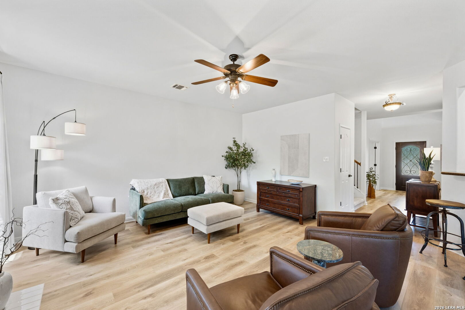 14507 John David Helotes, TX 78023 - Photo 12 of 52 a living room with furniture and a chandelier