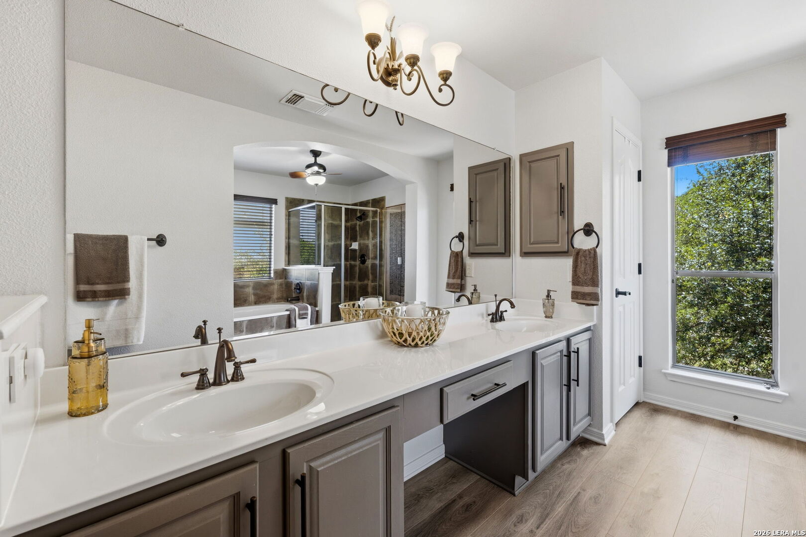 14507 John David Helotes, TX 78023 - Photo 14 of 52 a bathroom with a sink double vanity granite and a mirror