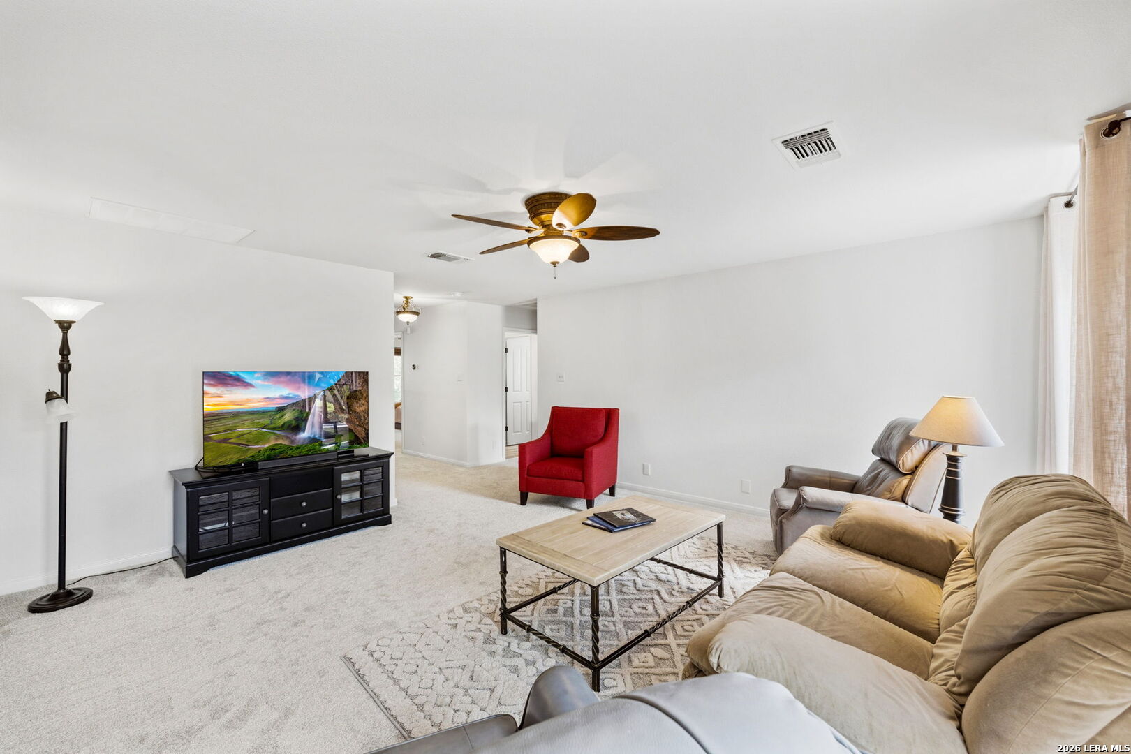 14507 John David Helotes, TX 78023 - Photo 16 of 52 a living room with furniture and a flat screen tv