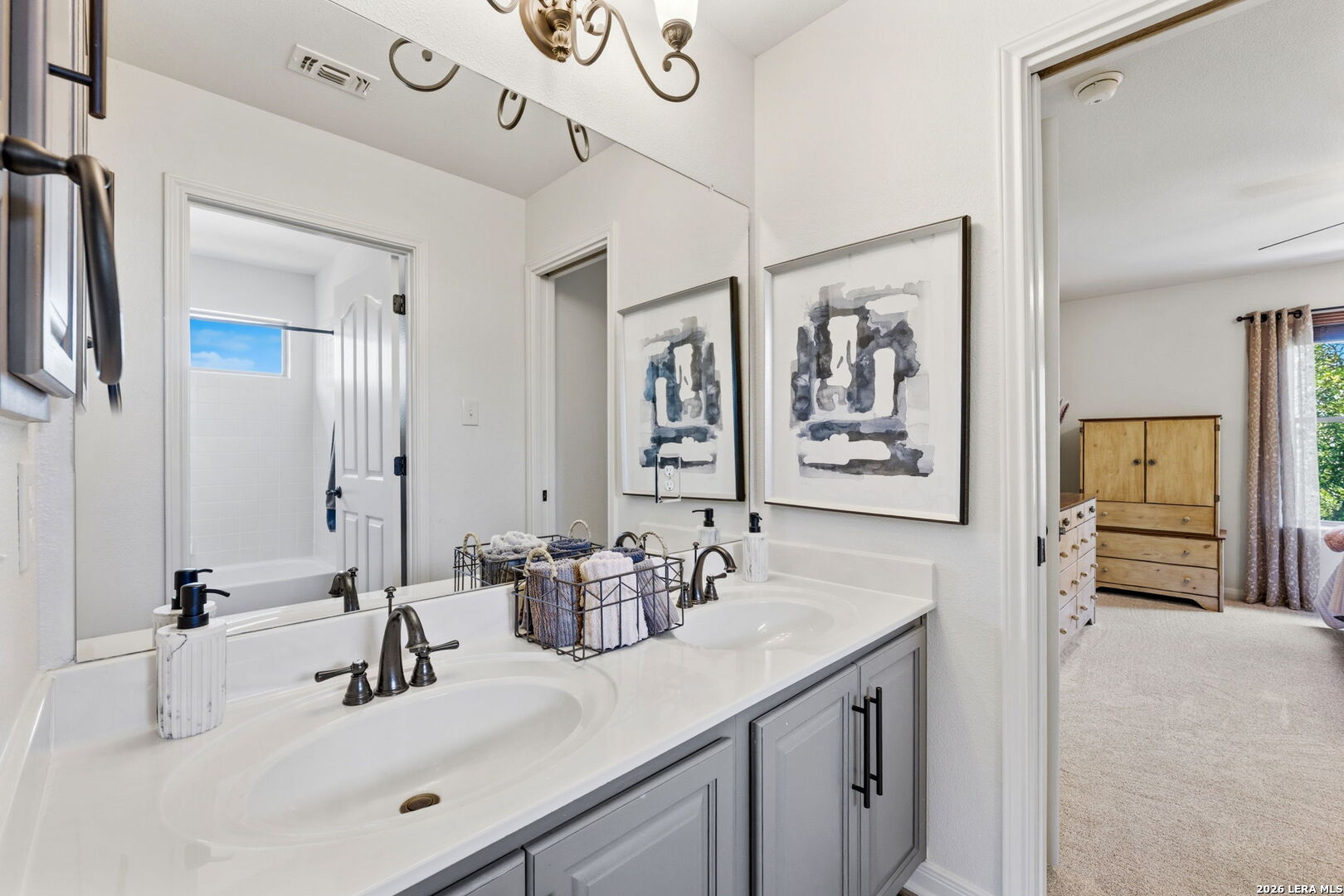 14507 John David Helotes, TX 78023 - Photo 20 of 52 a bathroom with a sink and a mirror