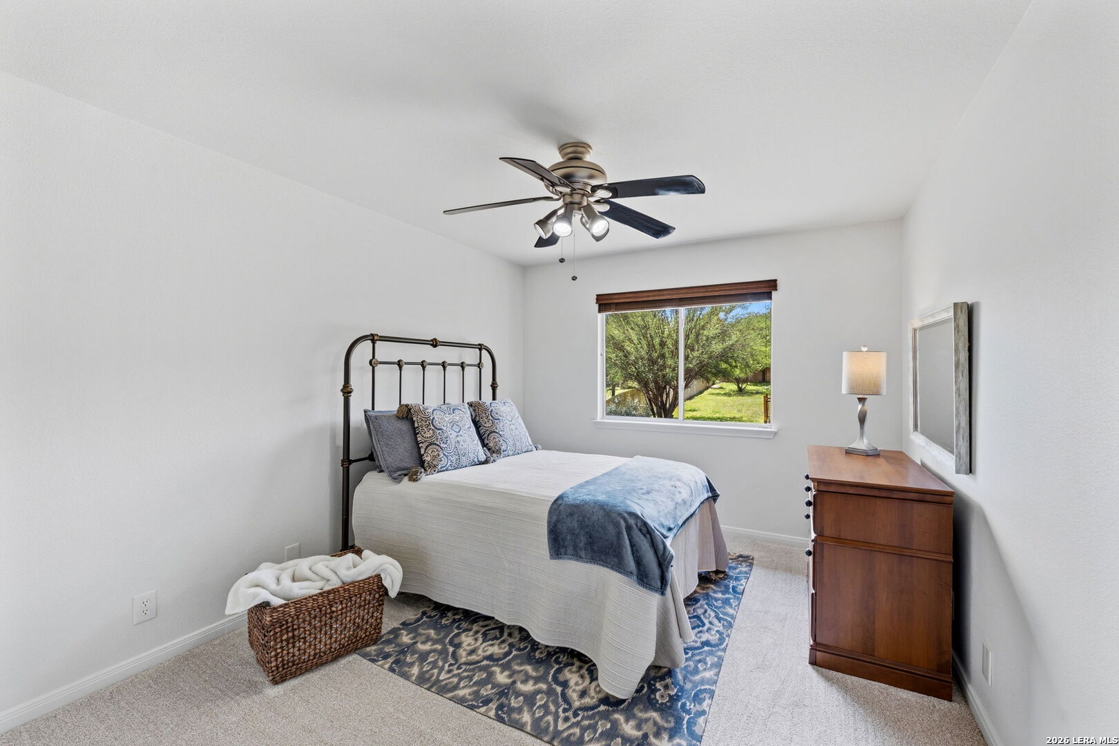 14507 John David Helotes, TX 78023 - Photo 21 of 52 a bedroom with a bed and a chandelier