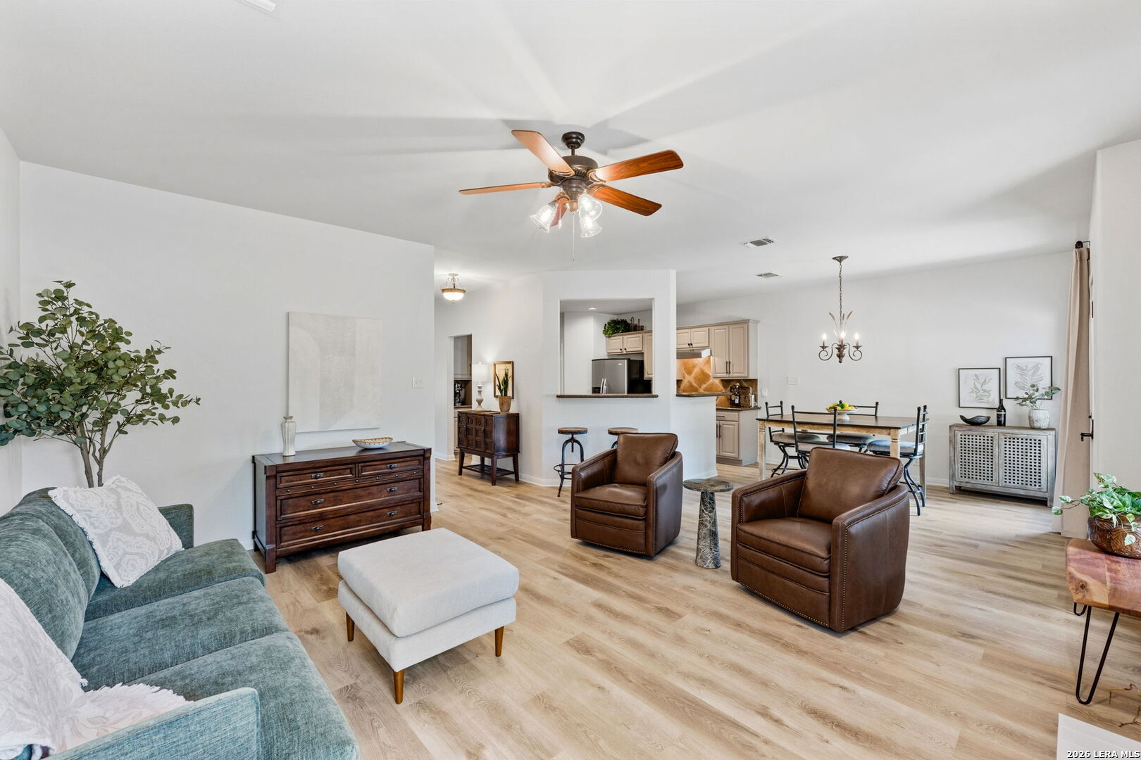 14507 John David Helotes, TX 78023 - Photo 22 of 52 a living room with furniture kitchen view and a potted plant
