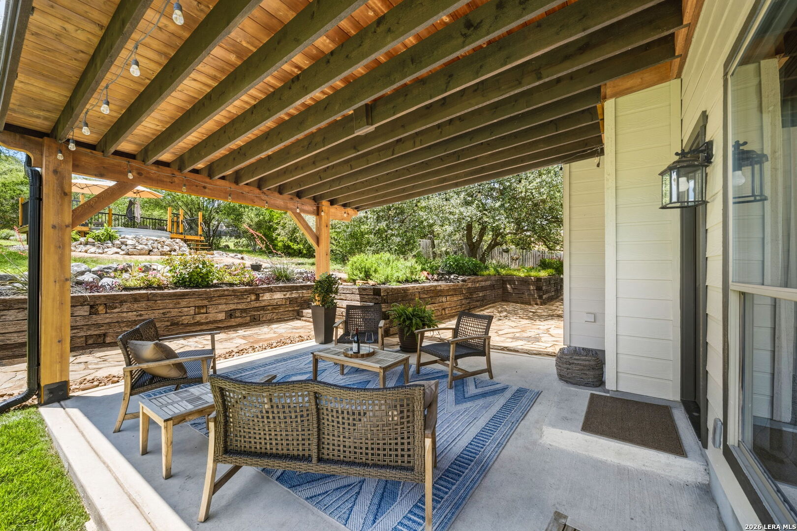 14507 John David Helotes, TX 78023 - Photo 23 of 52 a view of a patio with table and chairs and wooden floor