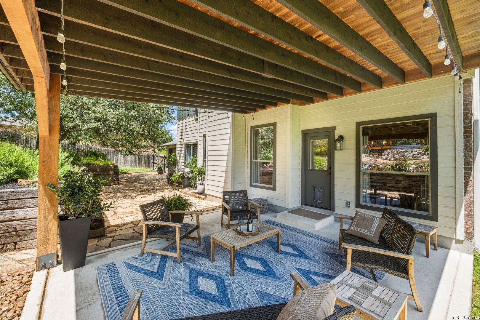 14507 John David Helotes, TX 78023 - Photo 30 of 52 a patio with glass top table and chairs