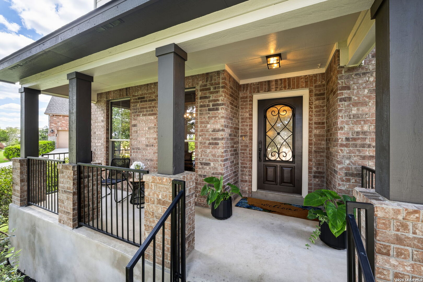 14507 John David Helotes, TX 78023 - Photo 3 of 52 a view of a brick house with potted plants