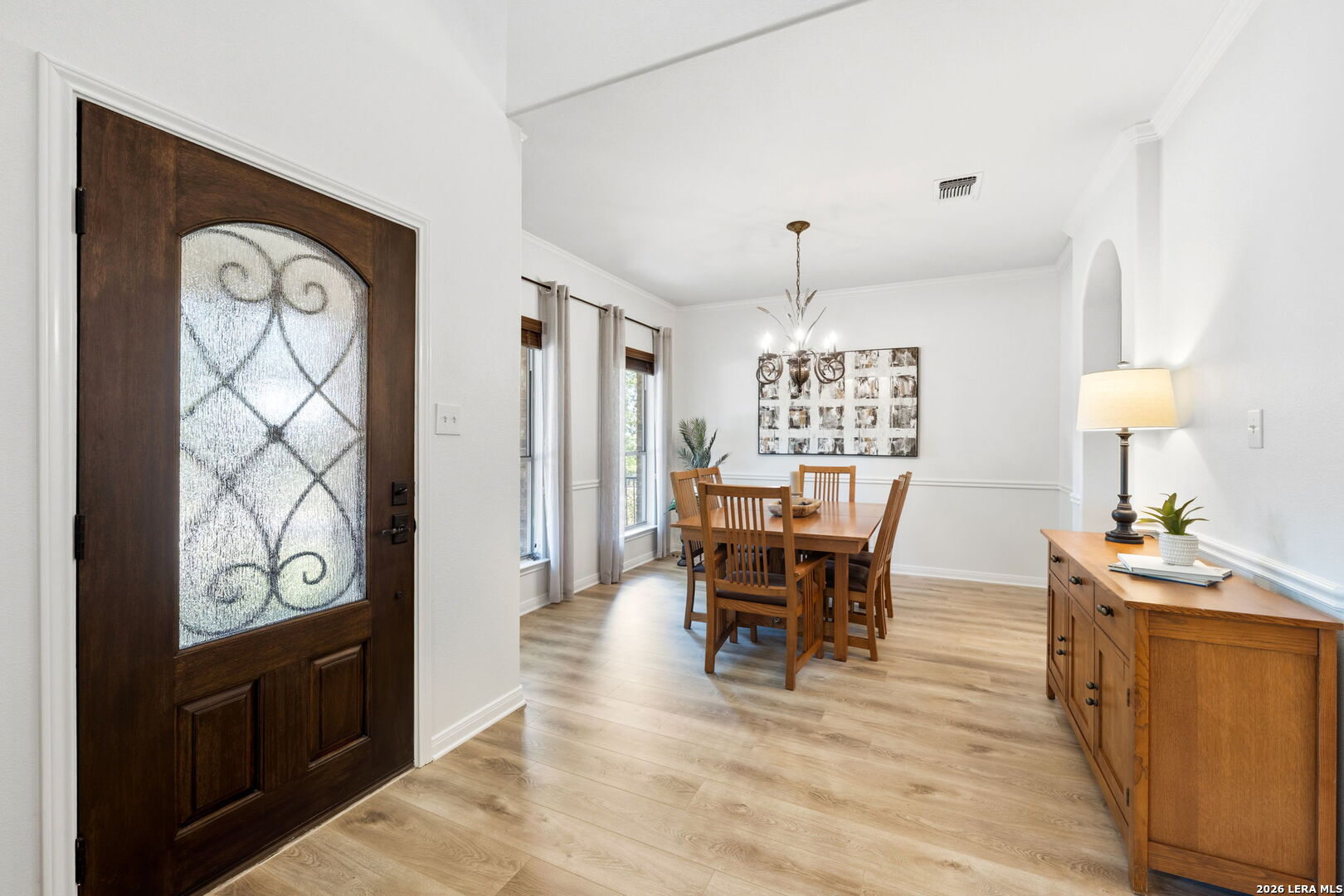 14507 John David Helotes, TX 78023 - Photo 8 of 52 a view of a dining room with furniture window and wooden floor