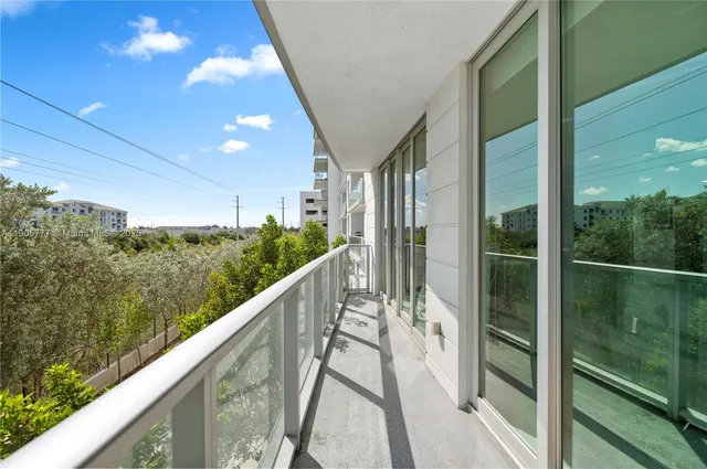 a view of balcony and yard