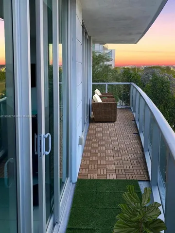 a view of balcony with furniture
