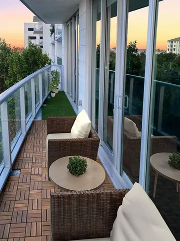 a view of balcony with furniture