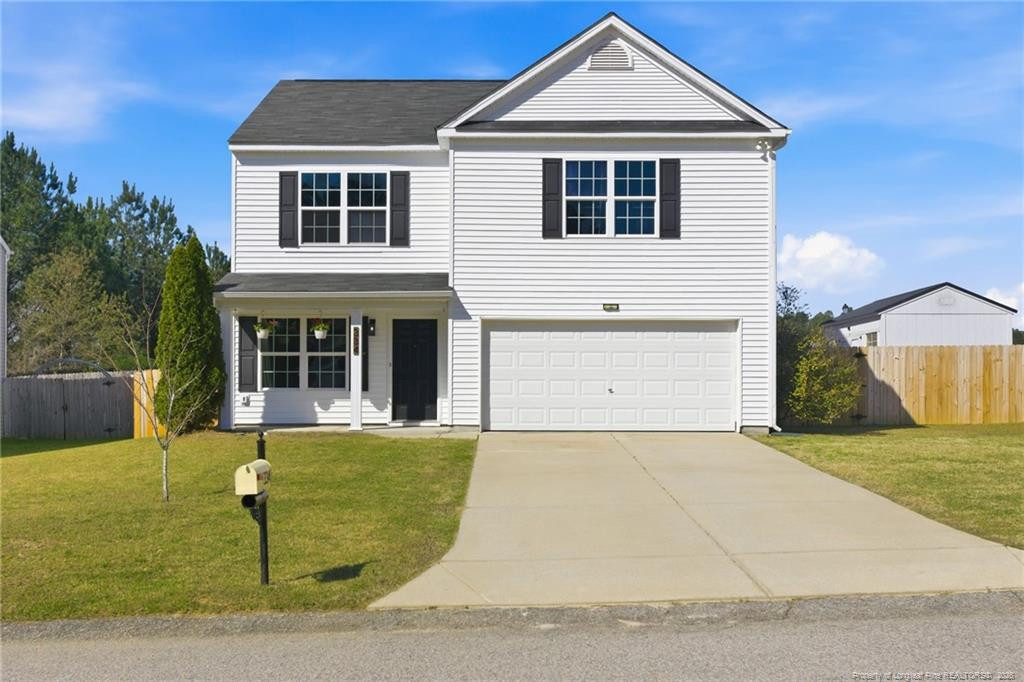 334 Crane Way Bunnlevel, NC 28323 - Photo 2 of 45 a front view of a house with a yard