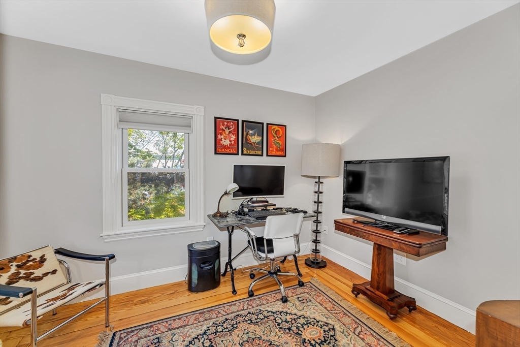 112 Perham Street Boston, MA 02132 - Photo 24 of 36 a living room with furniture and a flat screen tv