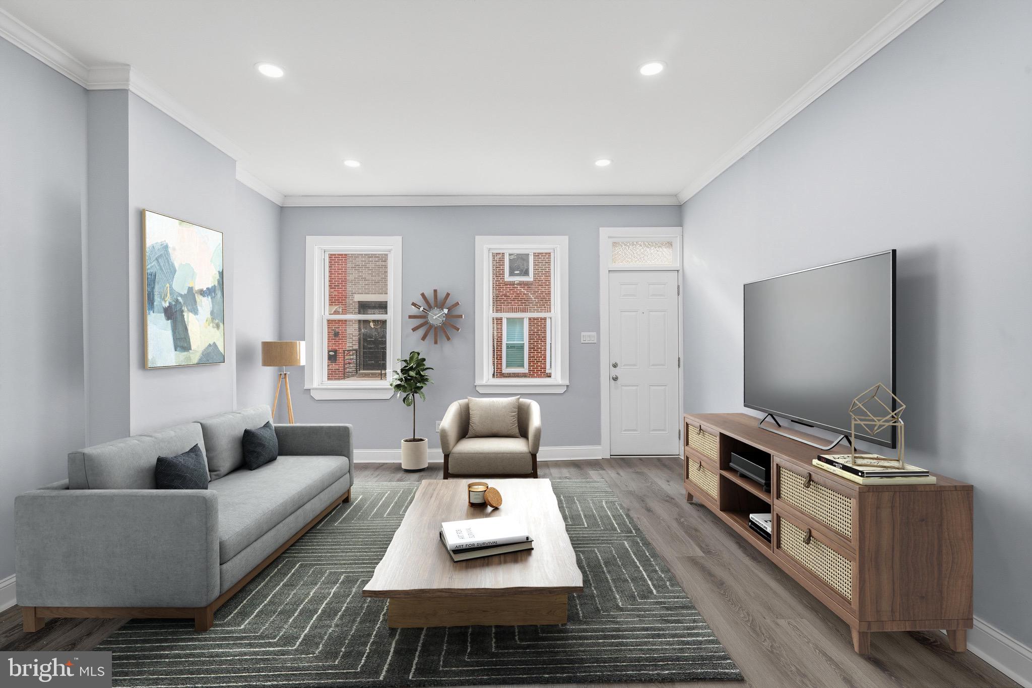 a living room with furniture and a flat screen tv