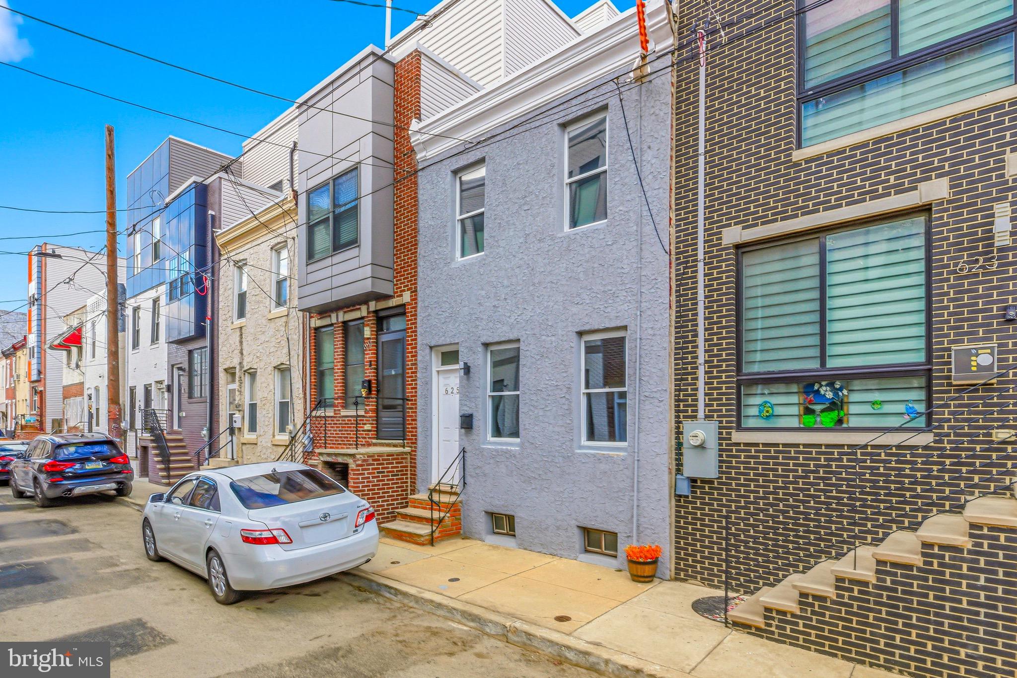 625 Cantrell Street Philadelphia, PA 19148 - Photo 10 of 15 a car parked in front of a brick building
