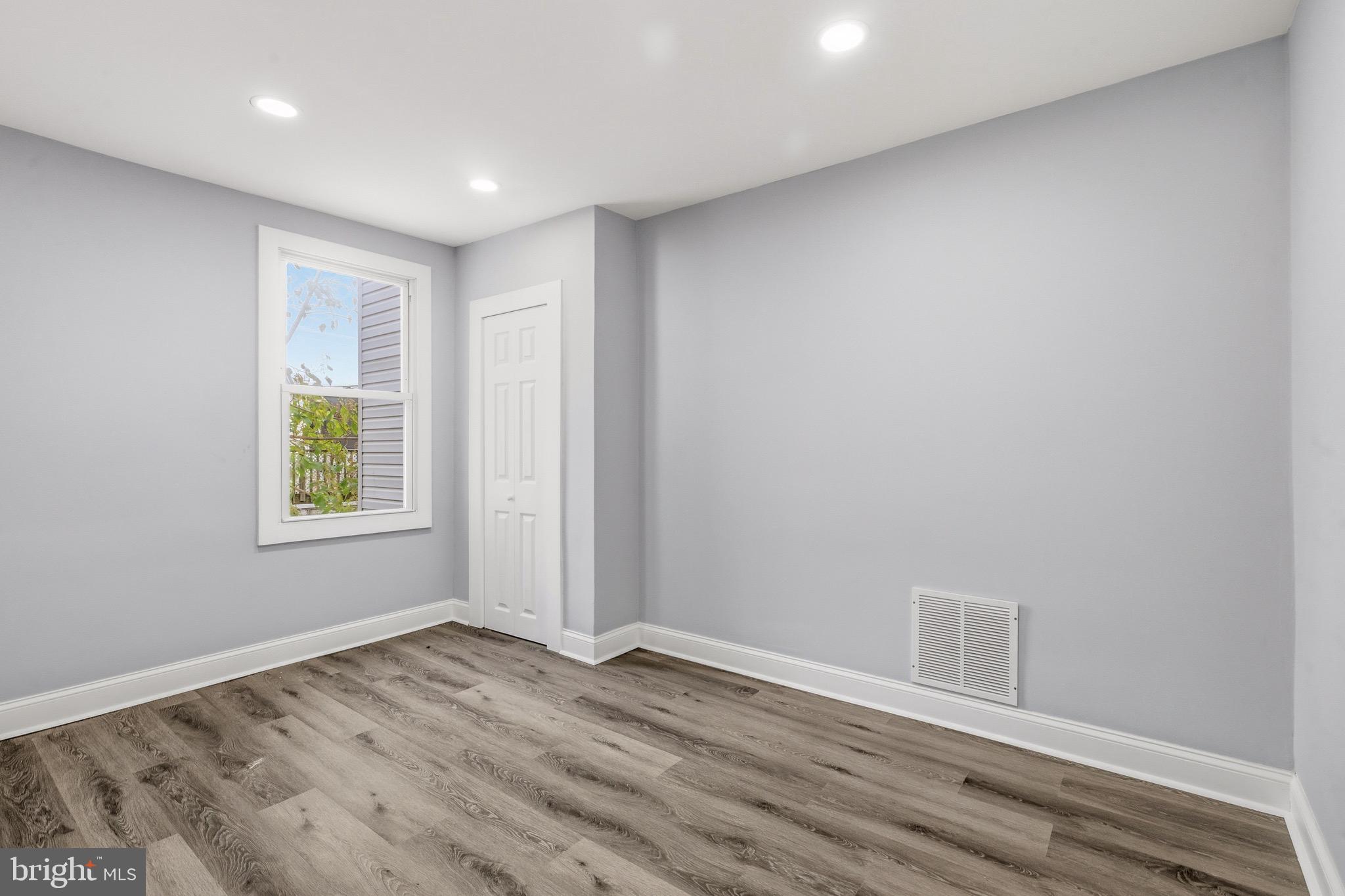 625 Cantrell Street Philadelphia, PA 19148 - Photo 6 of 15 a view of an empty room with wooden floor and a window