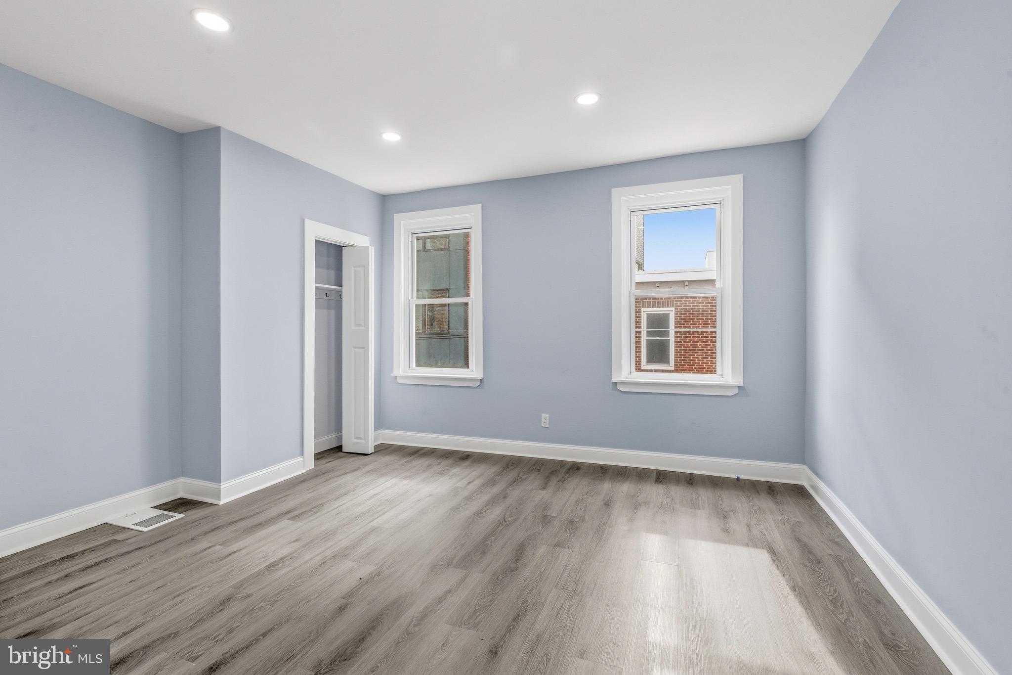 625 Cantrell Street Philadelphia, PA 19148 - Photo 7 of 15 an empty room with wooden floor and windows