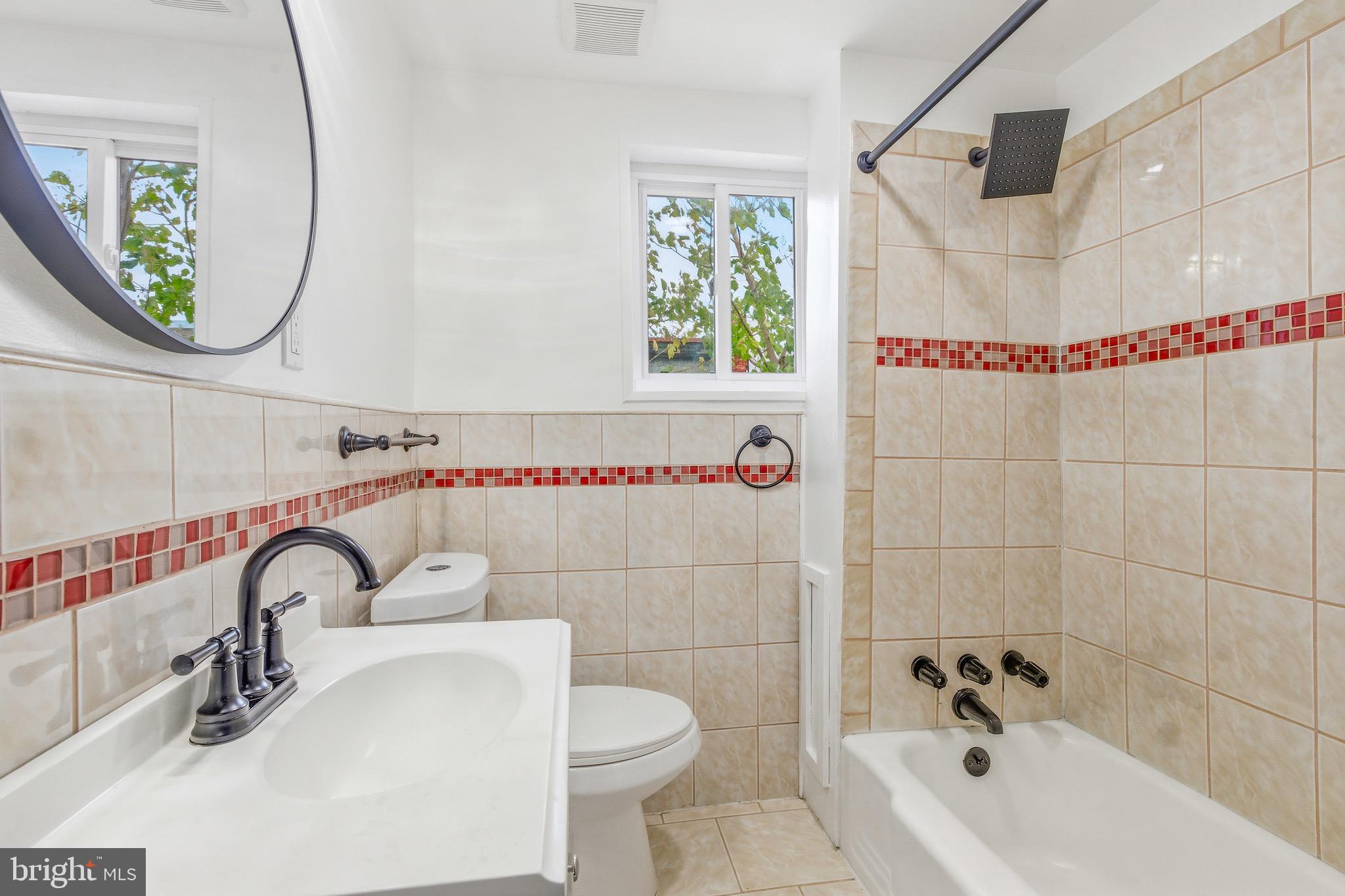 625 Cantrell Street Philadelphia, PA 19148 - Photo 8 of 15 a bathroom with a sink and a mirror